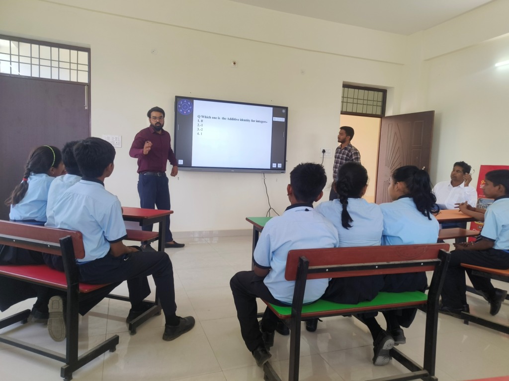 Students learning through smart board quiz